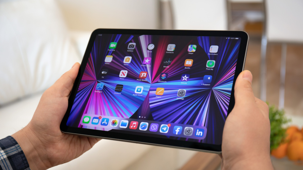 iPad tablet in hand