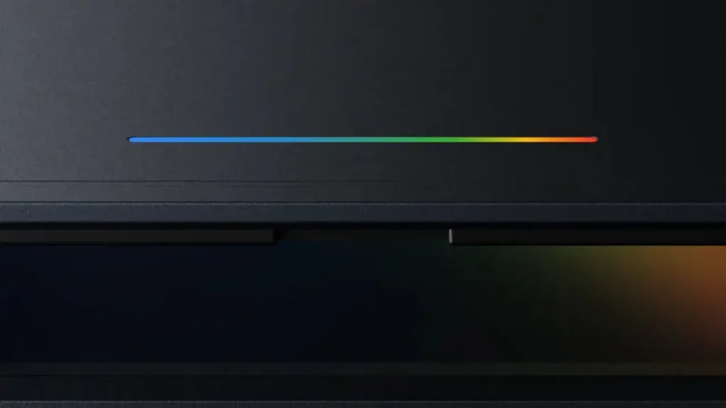 Thin rainbow gradient progress bar across a dark surface or device backdrop.